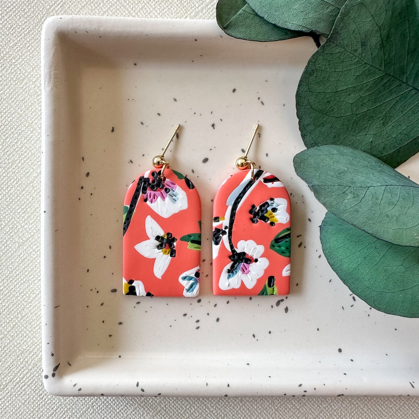 coral floral long arch dangles