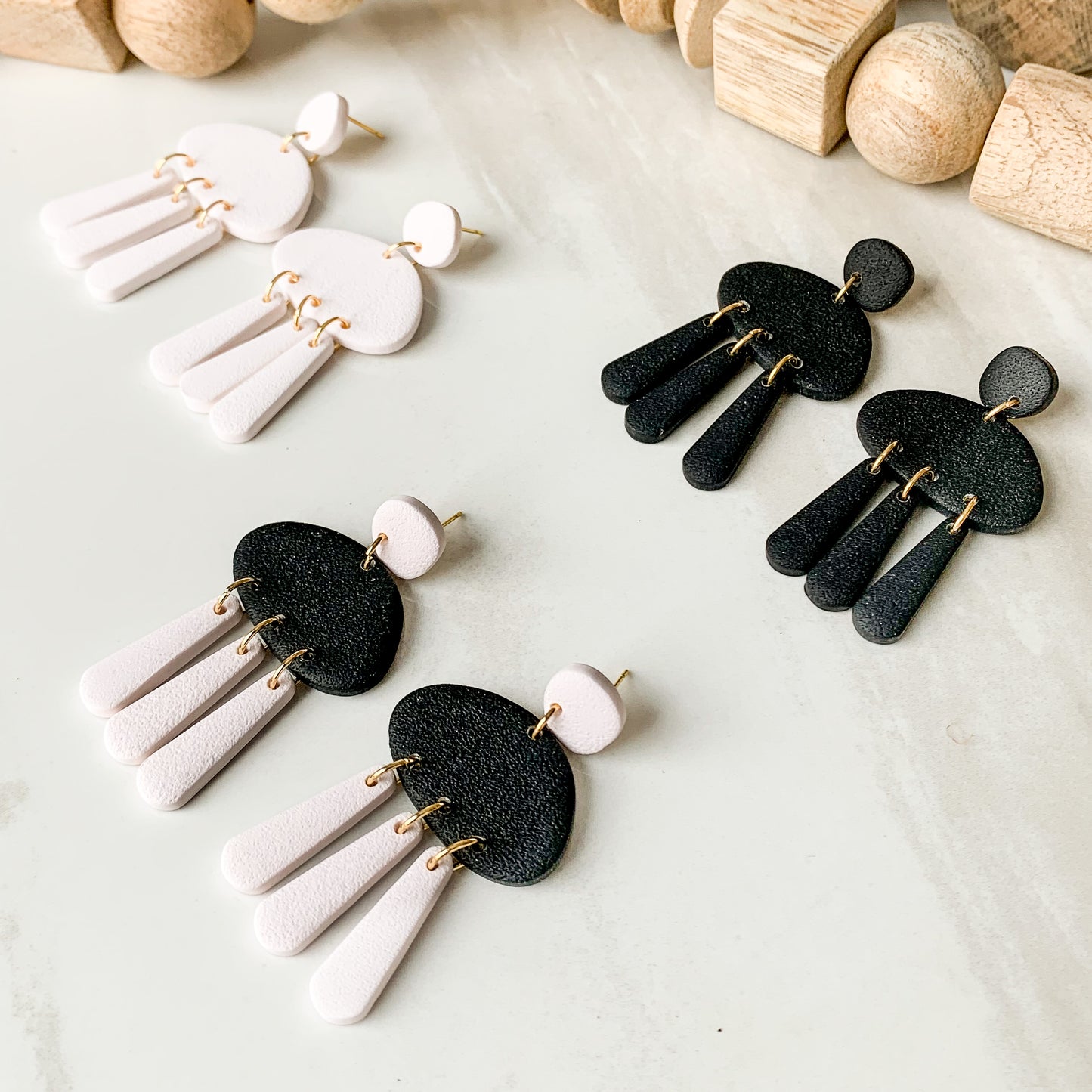 pebble textured dangle earrings | black & creamer